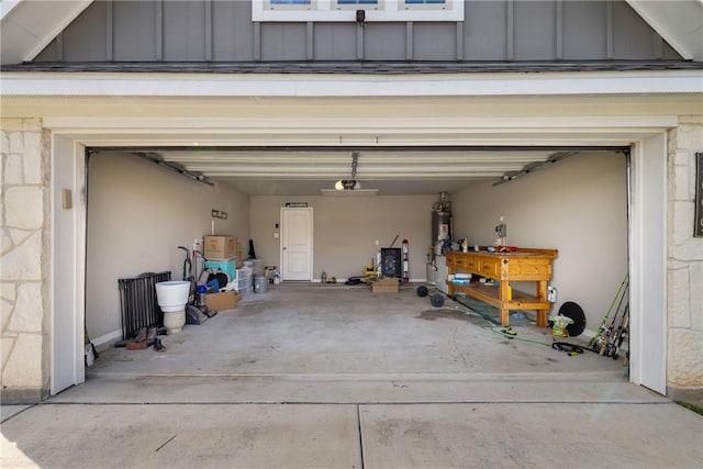 2099 Positano Loop, Bryan, TX 77808 - garage featuring concrete driveway and water heater