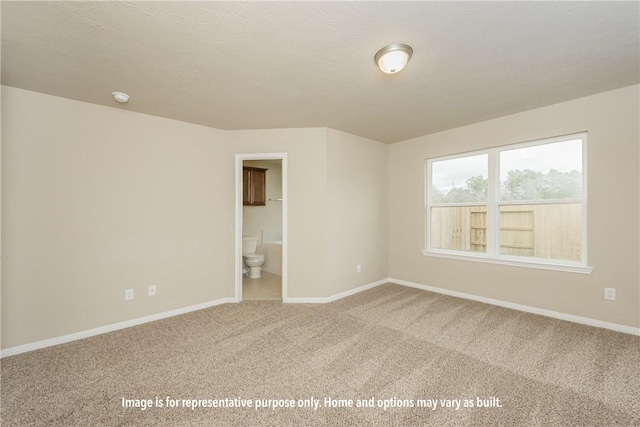 301 Whaley St, Caldwell, TX 77836 - unfurnished room featuring baseboards and carpet
