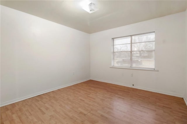 unfurnished room featuring light hardwood / wood-style floors