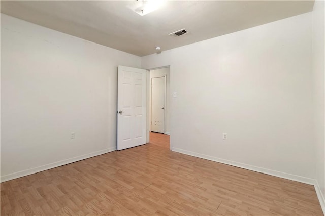 unfurnished room featuring light hardwood / wood-style flooring