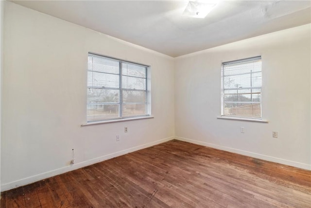 unfurnished room featuring wood-type flooring