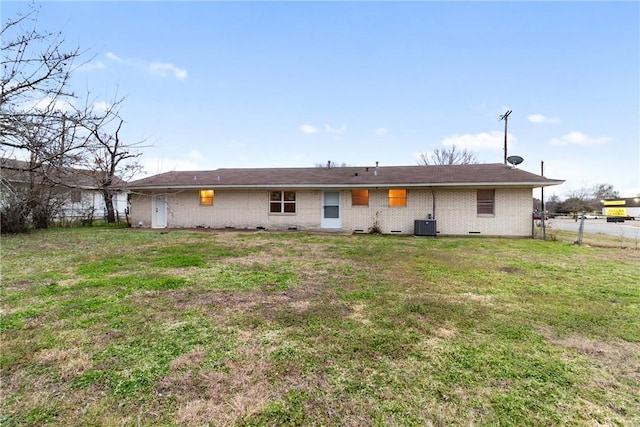 back of property featuring a yard and central AC unit