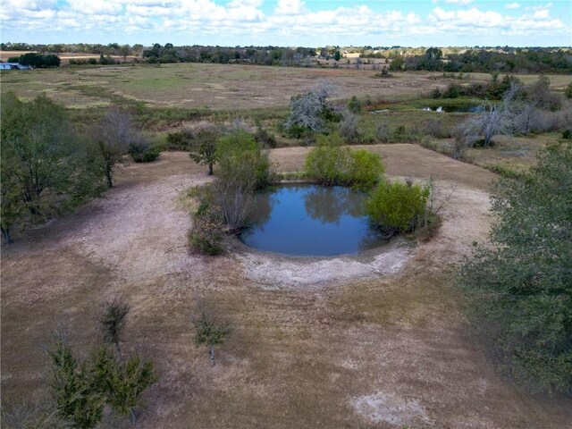 bird's eye view featuring a rural view and a water view