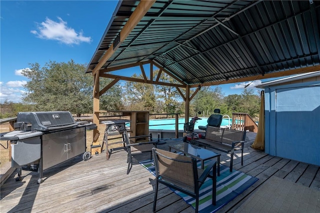 deck with an outdoor living space and grilling area