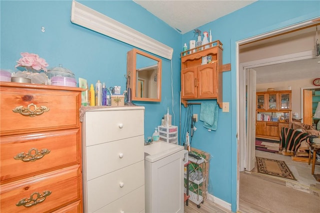 interior space with washer and dryer and light hardwood / wood-style floors