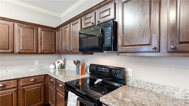 kitchen with black appliances, light stone countertops, and crown molding