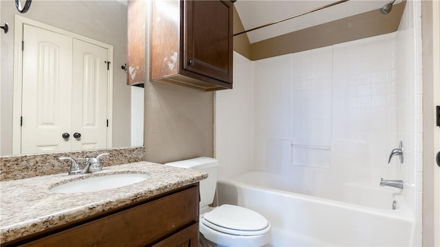 bathroom featuring a closet, shower / bathing tub combination, vanity, and toilet