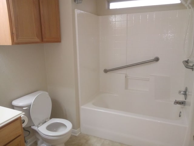 bathroom featuring tub / shower combination, vanity, and toilet