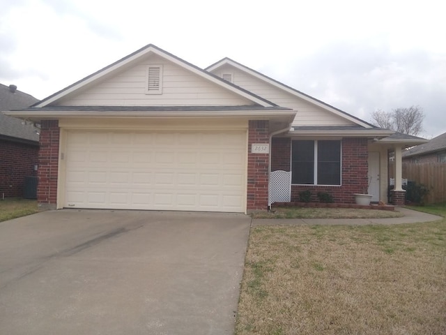 single story home featuring a garage, concrete driveway, cooling unit, a front lawn, and brick siding