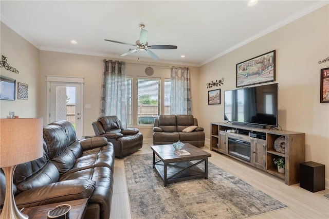 living room with plenty of natural light, recessed lighting, and a ceiling fan