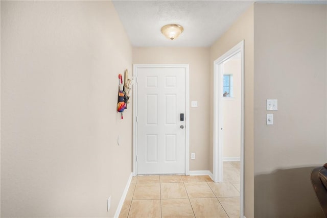 3807 Meadow View Dr, College Station, TX 77845 - foyer with light tile patterned flooring and baseboards