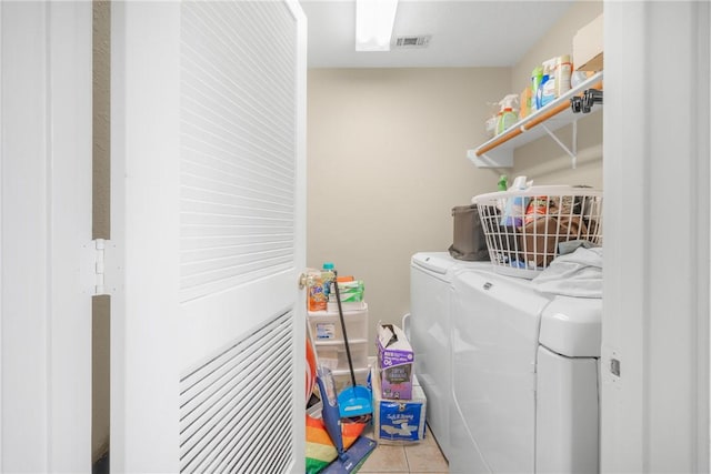 3807 Meadow View Dr, College Station, TX 77845 - laundry room featuring washing machine and clothes dryer and tile patterned floors