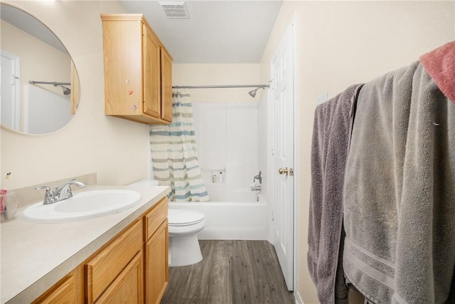 3807 Meadow View Dr, College Station, TX 77845 - bathroom featuring wood finished floors, vanity, and shower / tub combo