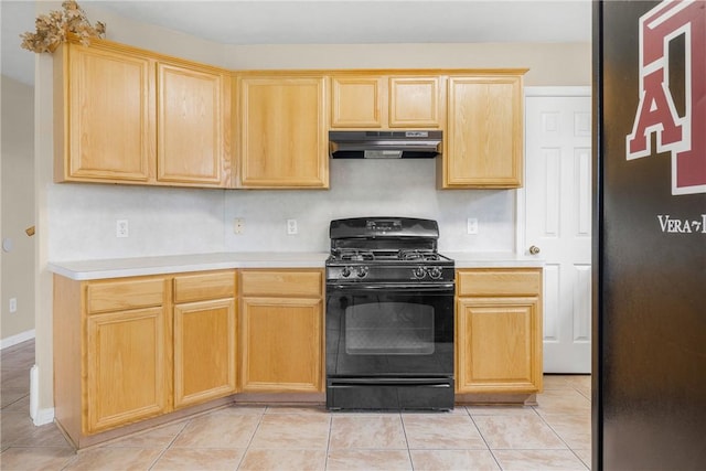 3807 Meadow View Dr, College Station, TX 77845 - kitchen with gas stove, under cabinet range hood, light brown cabinets, and light countertops