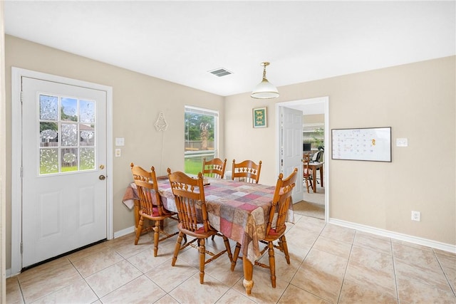 3807 Meadow View Dr, College Station, TX 77845 - dining space with baseboards and light tile patterned flooring