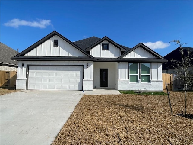 view of front facade with a garage and a front lawn