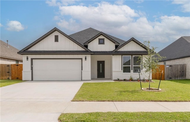 2908 Goldberg Dr, Bryan, TX 77808 - view of front of property featuring driveway, an attached garage, a shingled roof, and board and batten siding