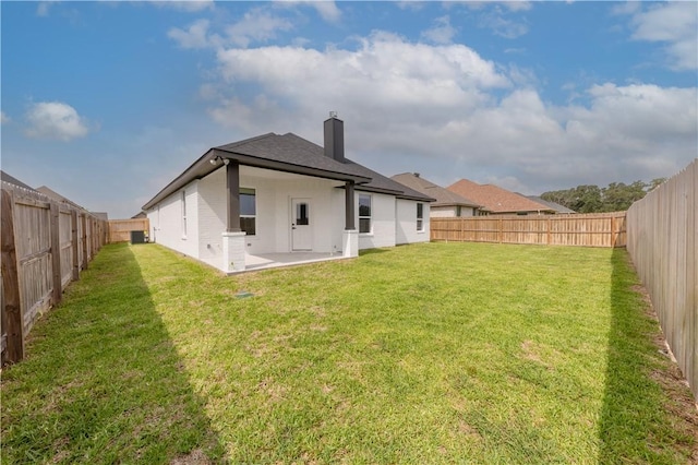 2908 Goldberg Dr, Bryan, TX 77808 - back of property featuring a chimney, a patio area, and roof with shingles