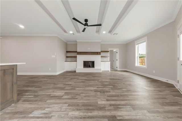 2908 Goldberg Dr, Bryan, TX 77808 - unfurnished living room featuring ceiling fan, wood finished floors, a fireplace with raised hearth, baseboards, and recessed lighting