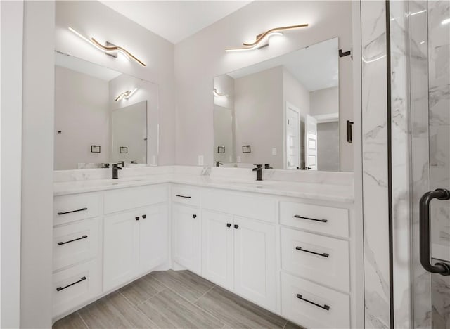 2908 Goldberg Dr, Bryan, TX 77808 - bathroom featuring double vanity and a marble finish shower