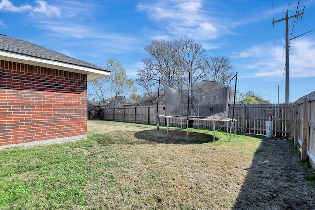 view of yard with a trampoline