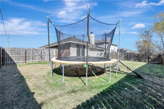 view of yard with a trampoline