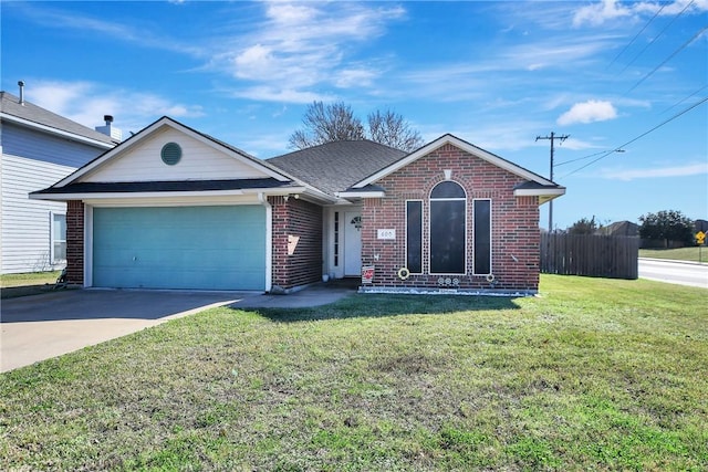 ranch-style home with a garage and a front yard