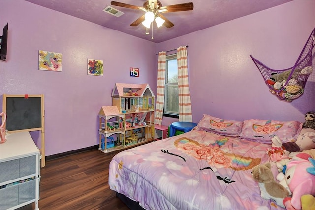 bedroom with ceiling fan and dark wood-type flooring