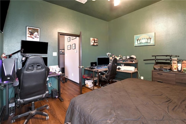 bedroom with hardwood / wood-style floors