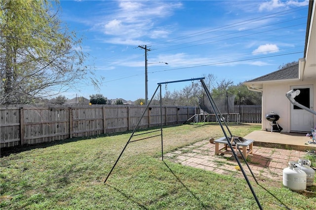 view of yard featuring a patio area and a trampoline