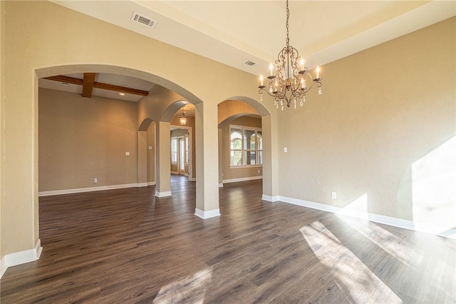 unfurnished room with visible vents, baseboards, beamed ceiling, arched walkways, and dark wood-style flooring