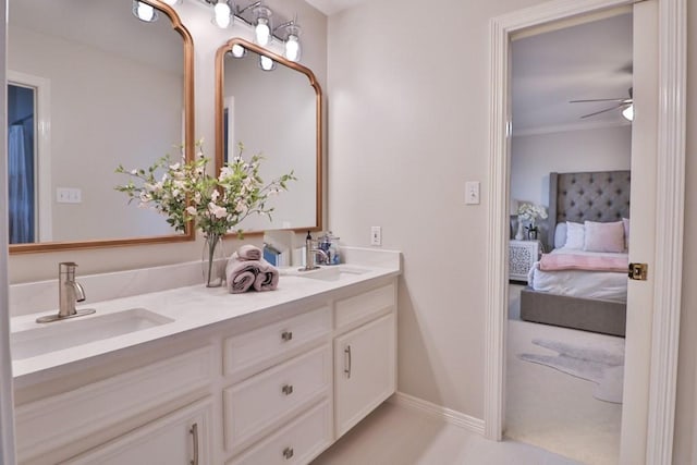 bathroom featuring ceiling fan, vanity, and ornamental molding