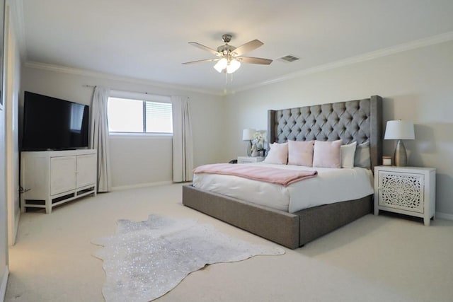 carpeted bedroom featuring ceiling fan and ornamental molding