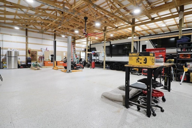 garage featuring stainless steel fridge