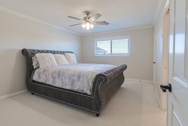 carpeted bedroom featuring ceiling fan and ornamental molding