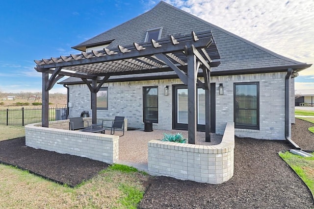 back of house with a pergola and a patio area