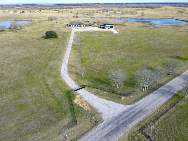 birds eye view of property with a rural view and a water view