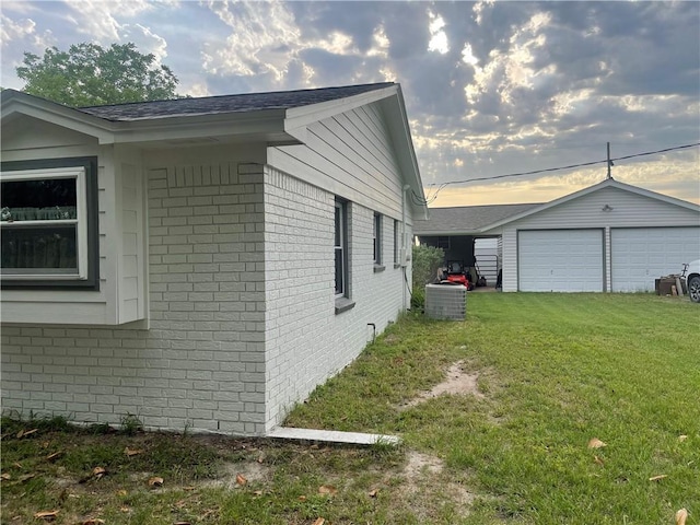 16659 Hwy 90 N, Bedias, TX 77831 - view of side of property with brick siding, a garage, and a yard
