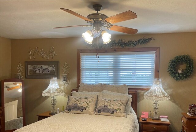 16659 Hwy 90 N, Bedias, TX 77831 - bedroom with a ceiling fan