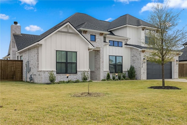 view of front of house with a front lawn and a garage