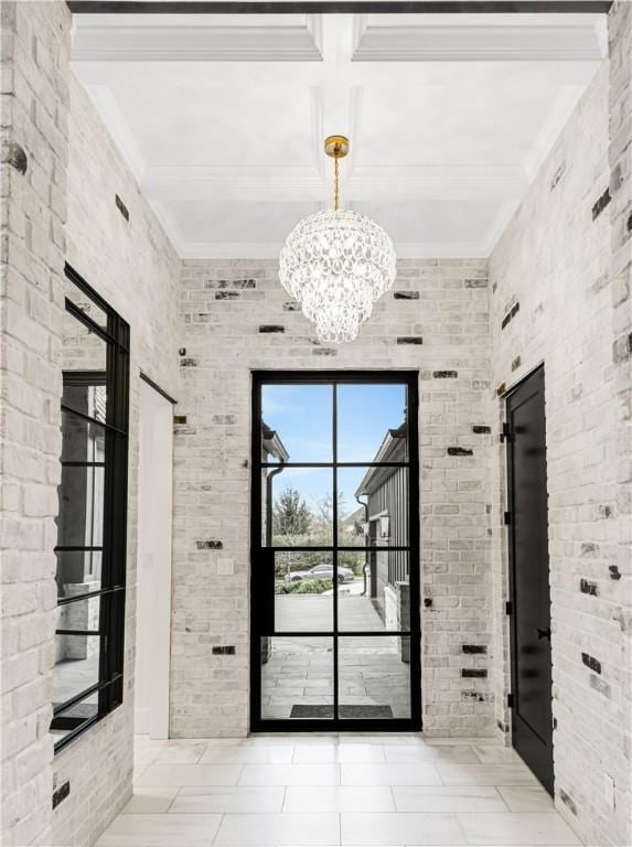 doorway to outside featuring brick wall and beam ceiling