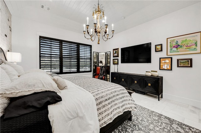 bedroom with a chandelier, visible vents, and baseboards