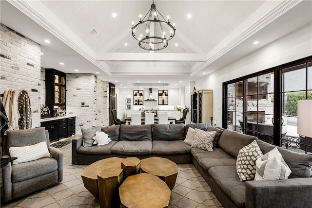 living area with high vaulted ceiling, a chandelier, crown molding, and brick wall