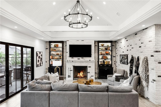 living room with brick wall, high vaulted ceiling, light wood-type flooring, and a fireplace