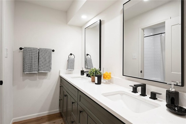 2800 Longmire Dr Unit 22, College Station, TX 77845 - full bathroom with double vanity, baseboards, and wood finished floors