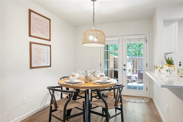 2800 Longmire Dr Unit 22, College Station, TX 77845 - dining area featuring light wood-type flooring, french doors, and baseboards