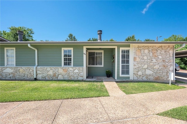 2800 Longmire Dr Unit 22, College Station, TX 77845 - view of front of house featuring stone siding and a front yard