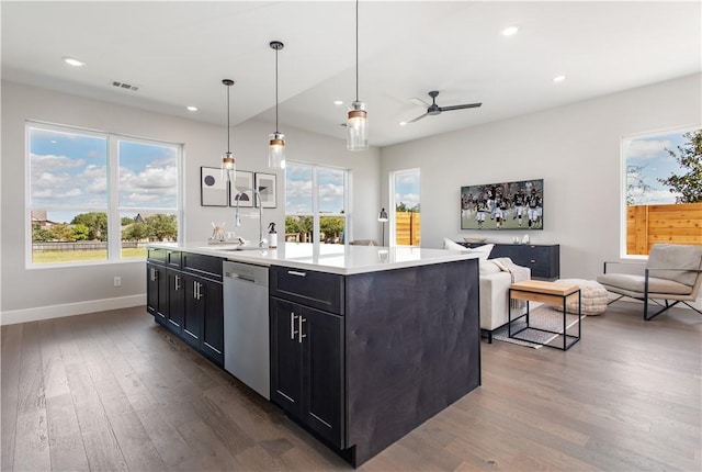 242 Estates Cir, College Station, TX 77840 - kitchen with dishwasher, dark wood-style floors, open floor plan, baseboards, and a ceiling fan