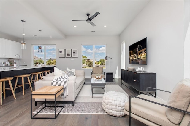 242 Estates Cir, College Station, TX 77840 - living room featuring a ceiling fan, recessed lighting, wood finished floors, and baseboards