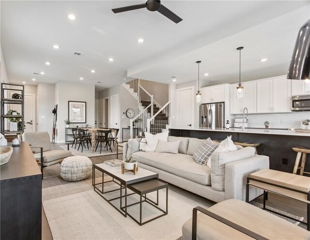 242 Estates Cir, College Station, TX 77840 - living room with ceiling fan, recessed lighting, and stairs
